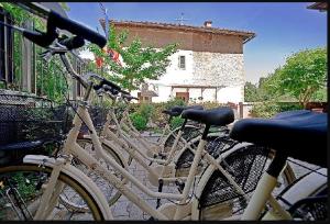 a group of bikes parked next to a building at Hotel Arcobaleno in Siena