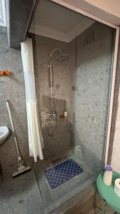 a shower in a bathroom with a glass door at Ahava Accommodation in Scottburgh