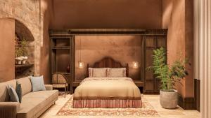 a bedroom with a bed and a couch at Aria Santa Maria in Santo Domingo