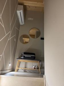 a small table in a room with a wall at La piccola Balilla in Venosa