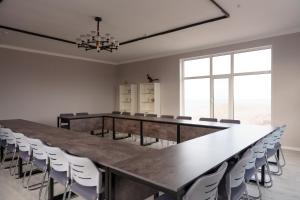 a large conference room with a long table and chairs at Ton Azure Hotel in Tong +50 photos