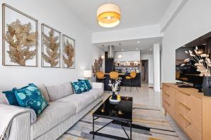 a living room with a couch and a table at Baie des Anges in Nice