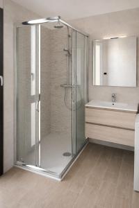 a bathroom with a shower and a sink at Il Gerlo in Lezzeno +28 photos