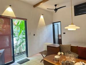 a living room with a couch and a table at Seseh Studio in Cemagi