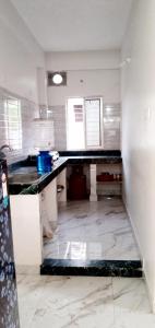 a kitchen with a counter top in a room at Mayapur in mayapur