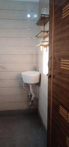a bathroom with a white sink in a room at Mayapur in mayapur