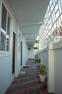 a hallway of a building with plants in it at Nyumbani 2 studio in Dar es Salaam