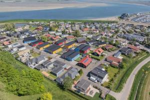an aerial view of a housing estate next to the ocean at chalet Lisa 62 in Sint Annaland