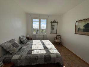 a bedroom with a bed and a window at Victoria House pool garden in Fourques +23 photos