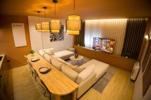 a living room with a couch and a table at Solen Suites in Korçë