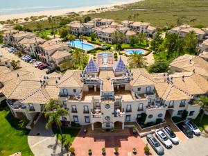 an aerial view of a large house with a pool at Leo San Bruno in Isla Canela