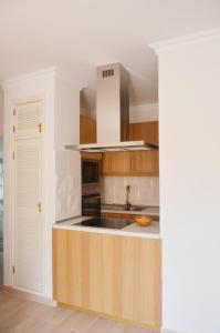 a kitchen with a sink and a stove at Paquita in La Laja +5 photos