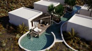 an aerial view of a house with a swimming pool at Eden Island in Agia Paraskevi