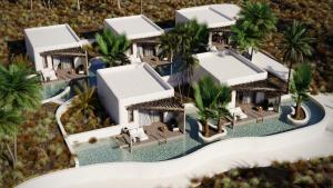 an aerial view of a resort with palm trees at Eden Island in Agia Paraskevi