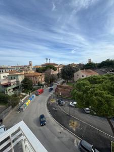 a city street with cars parked on the road at Le Casette di Elfo in Grosseto