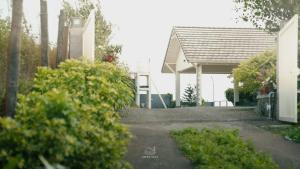a house with a pavilion in front of it at The Upper Deck in Pīrmed