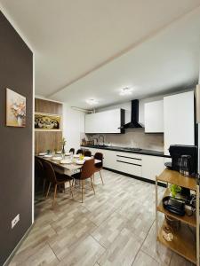 a kitchen and dining room with a table and chairs at Villa Felix in Omegna