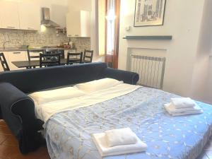 a bedroom with a bed with two towels on it at Bilocale zona Testaccio in Rome
