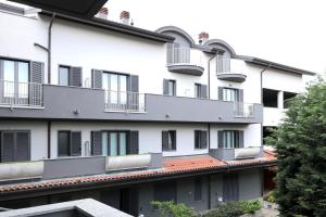 an apartment building with balconies on the side of it at Hotel Residence Aurora in Paderno Dugnano