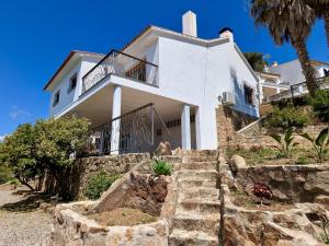 a white house with stairs in front of it at EVH-113 Casa Martina in Tossa de Mar