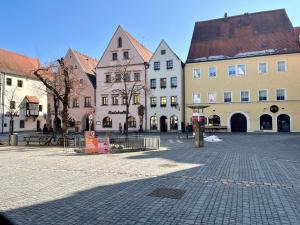 a group of buildings on a street in a city at Fidelios Altstadt Appartements in Weiden