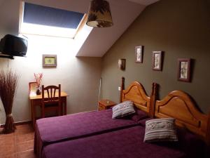 Postel nebo postele na pokoji v ubytování Hotel Mestas