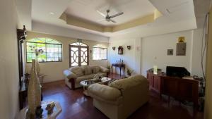 a living room with two couches and a tv at Hotel Vizcaíno León in León