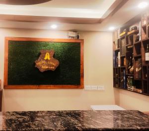 a painting of a justice league sign on a wall at Hotel Lisne jungle land in Bharatpur