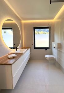 a bathroom with a sink and a toilet at Odda Gangdal Apartments in Odda +25 photos