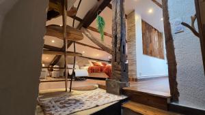 a living room with a tree in the middle at Loft Unique Romantique & Balnéothérapie in Riom