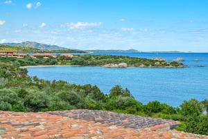 a view of the water from the roof of a building at Marineledda la terrazza sul golfo in Santa Marinella