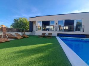 a backyard with a swimming pool and a house at Villa Nicoletta in Polača