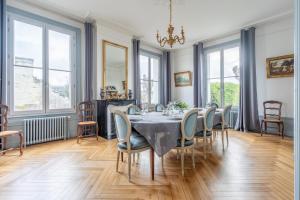 a dining room with a table and chairs at Maison bourgeoise, Rives du Cher, 14 pers in Montrichard +66 photos
