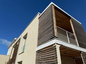 a balcony on the side of a building at Acquaviva Suites, Pool - View in San Vincenzo