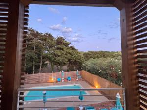 a view of a swimming pool from a balcony at Acquaviva Suites, Pool - View in San Vincenzo