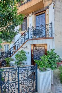 a staircase leading up to a building with a door at Charming City Stay close to Seafront in Birgu