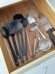 a drawer filled with lots of kitchen utensils at Bacacheri 5 Estrelas in Curitiba