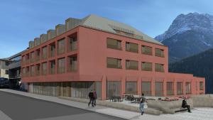 a red building with people walking in front of it at Plavna Apartment in Scuol +4 photos