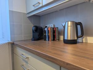 a coffeemaker sitting on a counter in a kitchen at Sauna Apartment Adelina Bad Wörishofen in Bad Wörishofen