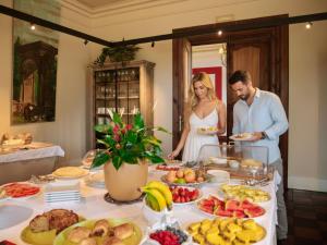 a bride and groom standing in front of a buffet of food at Hotel Palacio Urgoiti in Mungia