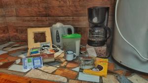 a counter with a blender and other items on it at La Momia in Cholila +7 photos