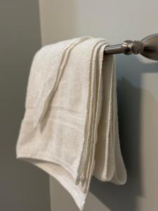 a towel hanging on a towel rack in a bathroom at The Moosehead in Glenwood +13 photos