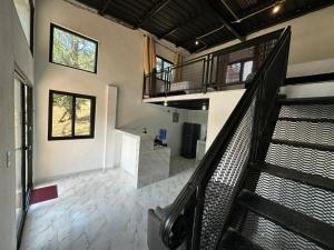 a staircase in a building with a stair case at Blue Dream in Los Altos de Cerro Azul