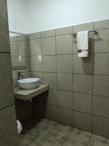 a bathroom with a sink and a white towel at casa bajlum in Valladolid +4 photos