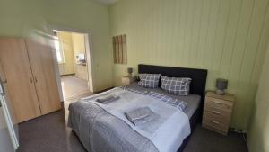 a bedroom with a bed with two pillows on it at Inselglück in Malchow