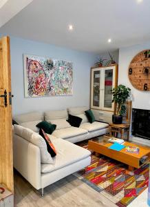 a living room with two couches and a coffee table at En-Suite Private Room Brocton Village in Bednall