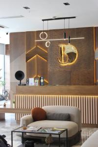 a living room with a couch and a table at Bonnie City Hotel in Antalya