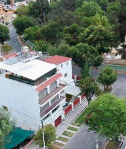 an overhead view of a white building with a red roof at Suite Chachani in Arequipa