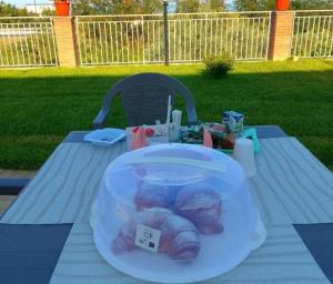 a table with a plastic plate with pastries on it at Villa Melina Bed & Breakfast in Agropoli