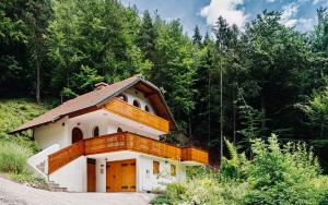 a small house in the middle of a forest at Mountain View House - Panoramic! in Gozd Martuljek
